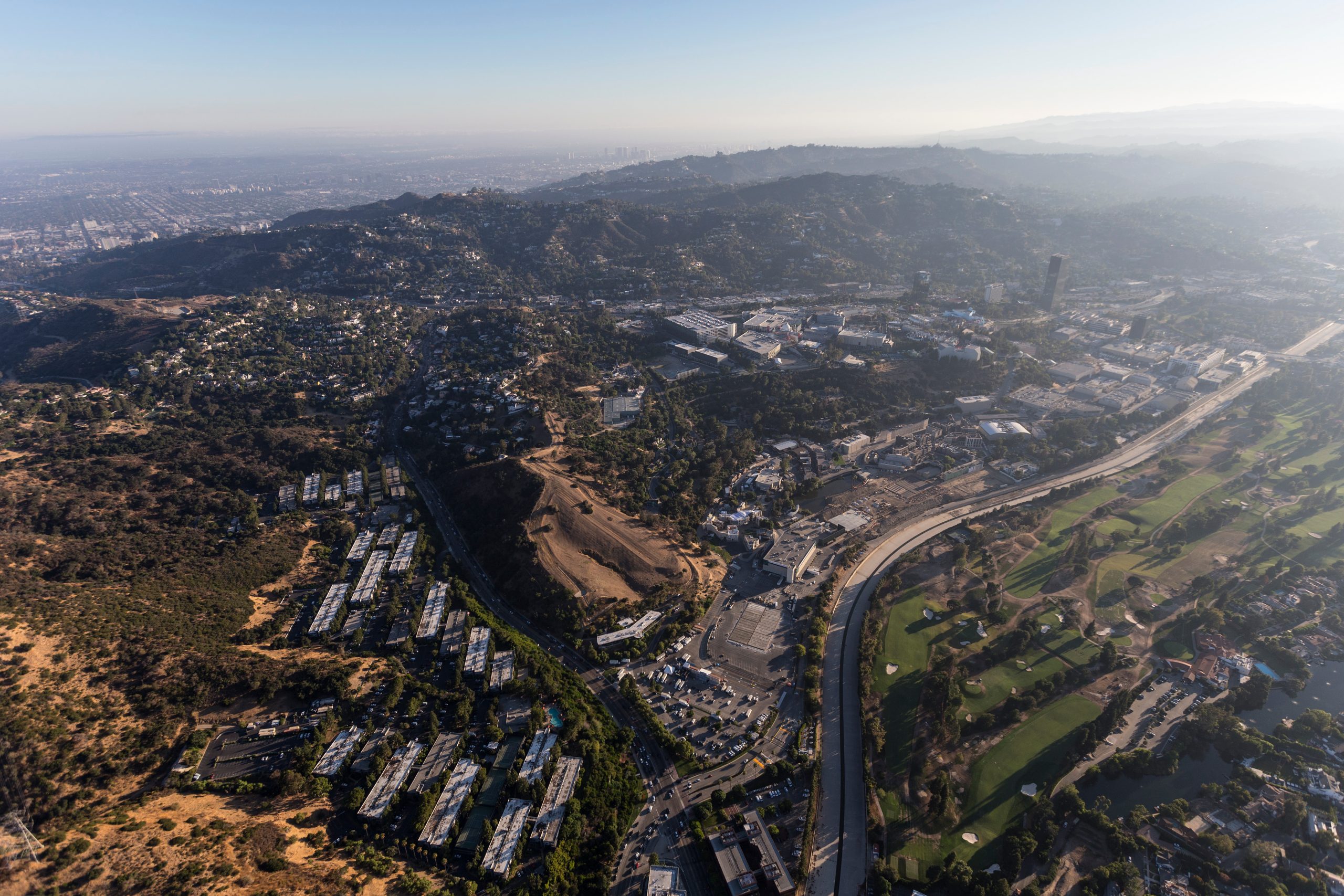 Aerial view towards Barham Blvd, the Los Angeles River, Toluca Lake and Universal City on the edge of the San Fernando Valley in Los Angeles, California.